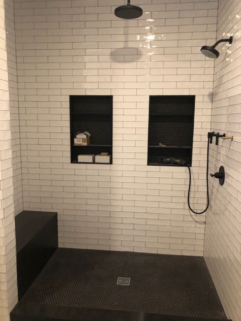 White Subway Tile Shower With Black Penny Tile Floor, Bathroom Shower Penny Tile, Black Penny Round Shower Floor, Penny Floor Shower Tile, Black Tile Black Grout Bathroom, Shower Subway Tile Dark Grout, Black Penny Round Tile Bathroom, White Subway Tile Shower Dark Grout, Shower With Dark Grout