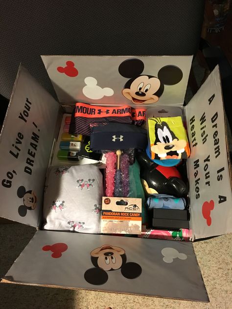 Disney Care Package for our College Student. “Go, Live Your Dream!” Included candy from WDW, socks, PJ’s, Disney hi-lighters & pens, UA shorts and a Disney towel. Disney Surprise Box Ideas Diy, Disney Care Package, Disney Care Package Ideas, Disney Surprise Box Ideas, Disney Gift Basket, Background Eraser, Disney Surprise, College Care Package, Spooky Gifts