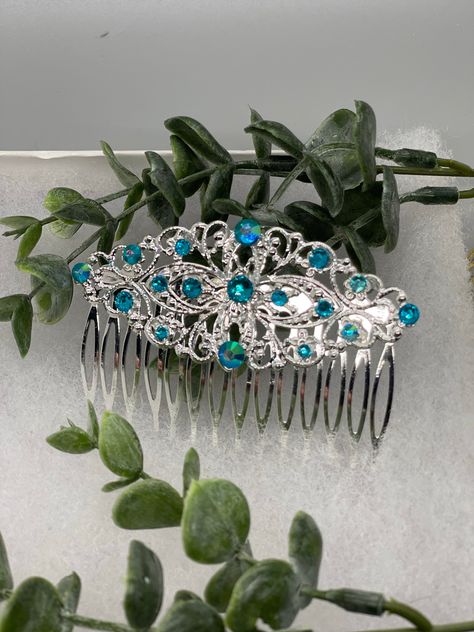 iridescent teal crystal vintage style silver tone side comb hair accessory accessories gift birthday event formal bridesmaid wedding 3.5” antique tone side comb The Hairdazzzel Accessory brings out the beauty and style within. Handcrafted from high-quality beads crystal ,Rhinestone every piece from the hairdazzzel hair Jewelry collection is designed to emphasize and accentuate your individual personality. More than something you’ll wear once and forget, your unique hair Jewelry hair accessories Turquoise Silver Wedding, Dance Hair Piece, Shen Jiu, Teal Accessories, Underwater Wedding, Antique Hair Combs, Blue Hair Accessories, Headband Accessories, Prom Hair Accessories