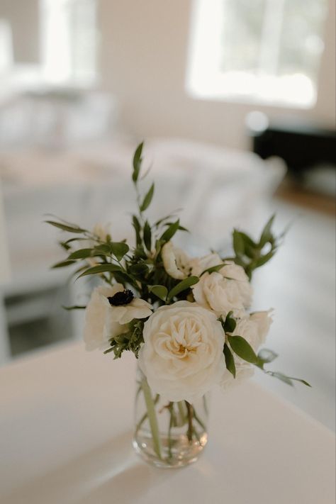 Greenery Wedding Circle Table, Peony Bud Vase Centerpiece, Simple Floral Table Centerpieces, White Rose And Italian Ruscus Bouquet, Peony Flower Table Decoration, Bridal Shower White Flower Arrangements, Small All White Flower Arrangements, Eucalyptus And White Centerpiece, Engagement Party Floral Centerpieces