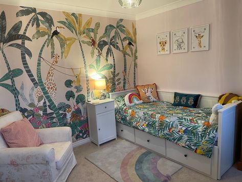 Jungle themed with rainbows. Dunelm mural wallerpaper Dunelm Jungle Mural, Dunelm Mural, Girls Jungle Bedroom, Jungle Bedroom Kids, Minnie Bedroom, Jungle Bedroom Theme, Jungle Theme Rooms, Jungle Themed Bedroom, Jungle Bedroom