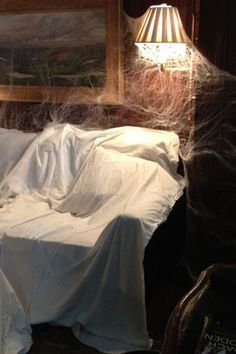 Furniture Covered In Sheets, Cobweb Decor, Haunted House Room Ideas, Diy Halloween Scary, Covered Furniture, Orange Couch, Haunted House Ideas, Ghost House, Teachers Lounge