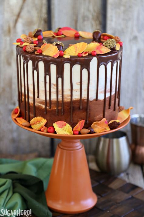 Festive Fall Layer Cake – a beautiful autumn cake! It’s a moist chocolate cake with a caramel-pecan filling, decorated with chocolate ganache drips and gorgeous, edible fall decorations! | From SugarHero.com Fall Birthday Cakes, Pecan Filling, Fall Cake Recipes, Nursing Cake, Inside Cake, Thanksgiving Cakes, Layer Cake Recipes, Chocolate Cake Decoration, Rich Chocolate Cake