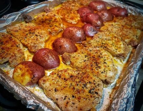 One-Pan Baked Pork Chops with Seasoned New Potatoes - receipster Baled Pork Chops, Baked Spaghetti And Meatballs, Pan Pork Chops, Pork Chops And Potatoes, Pork Chop Recipes Baked, New Potatoes, Baked Pork Chops, Baked Pork, New Potato