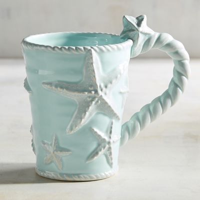 ON SALE!! This is so elegant and beautiful!! So cheap too!! Perfect for your beach theme house 🏡   Get yours here!   With three-dimensional starfish and rope motifs, our earthenware mug is the perfect gift for the beach aficionado in your life. Beach Theme House, Theme House, Beach Cups, Beach Inspired Decor, House Of Turquoise, Clay Mugs, Diy Pottery, House Decorating, Indoor Patio Furniture