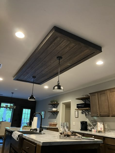 Kitchen Accent Ceiling, Farmhouse Island Chandelier, Wood Ceiling Above Kitchen Island, Ceiling Box Above Kitchen Island, Wood Ceiling Over Kitchen Island, Large Room Lighting Ideas, Wood Beams In Tray Ceiling, Kitchen Ceiling Ideas Modern, Black Shiplap Ceiling