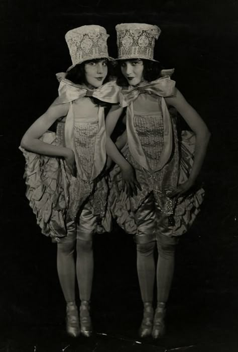 Vintage ca. late 1910′s / early 1920′s photograph of Ziegfeld Follies showgirls the Fairbanks Twins, Madeline and Marion, in a spirited jazz age costume view. Though not actually twins, the sisters were a fixture in vaudeville, early silent film, and become featured stars in the Ziegfeld Follies and Midnight Frolic revues. (by Culver Pictures Inc., NY) / Busby Berkeley, Broadway Costumes, This Side Of Paradise, Ziegfeld Girls, Costume Clothes, Flower Costume, Ziegfeld Follies, Burlesque Costumes, Jazz Age