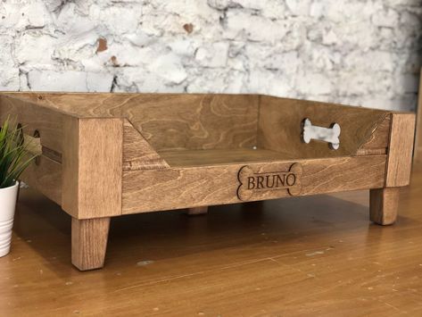 "Customizable Raised wooden dog bed is created for small and large pets. This elevated engraved dog bed will be a stylish decoration of your interior. * * DESCRIPTION * ➡️ Wooden bed materials: top quality plywood; 12 mm, 6 mm ➡️ Reinforced bottom, 8 mm ➡️ Legs are made of natural wood, height 3 inches (7 cm) ➡️Bed Color: brown, gray, dark brown * MORE * Modern dog bowls https://www.etsy.com/listing/1029845884 * SIZES * EXTRA SMALL (XS): fits for miniature dog breeds (Pekingese, Chihuahua, etc.) Wooden Dog Bed Ideas, Wood Pet Bed, Homemade Dog Beds For Small Dogs, Dog Wooden Bed, Pekingese Chihuahua, Dog Bed Wood, Wooden Dog Bed Frame, Raised Wooden Dog Bed, Bed Mid Century