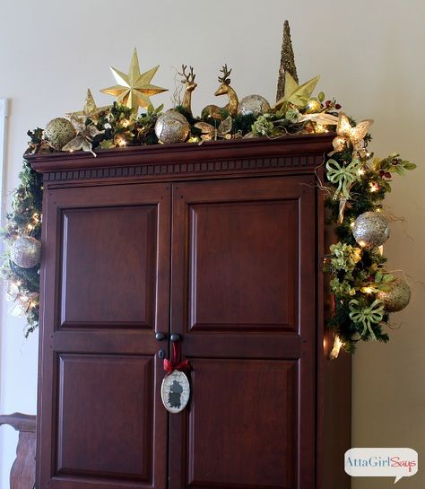 Great idea for decorating the top of an armoire or TV cabinet for Christmas. Don't forget about those spaces! Decorating The Top Of An Armoire, Top Of Kitchen Cabinets, After Christmas Sales, Christmas House Tour, Entertainment Center Decor, Indoor Christmas Decorations, Indoor Christmas, Christmas House, Christmas Deco