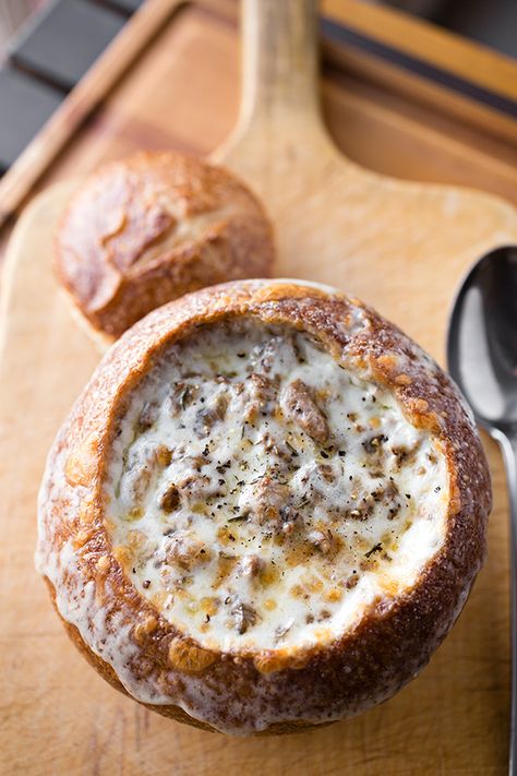 This original Philly cheesesteak stew filled with thinly-sliced sirloin, onions and even mushrooms is a warming twist on a beloved sandwich! | thecozyapron.com #phillycheesesteakstew #phillycheesesteakinabreadbowl #phillycheesesteakbeefstew Loaves Of Bread, Pane Dolce, Bread Bowl, Philly Cheesesteak, Soup And Stew, Bread Bowls, Think Food, Philly Cheese Steak, Bowl Of Soup