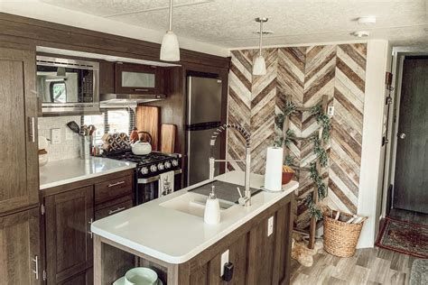 Courtney Wallpaper, Rv Interior Design, Wooden Accent Wall, Rv Interior Remodel, Camper Trailer Remodel, Diy Camper Remodel, Rv Homes, Sectional Furniture, Rv Renovations