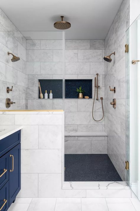 21 Walk-In Shower Ideas For Any Size Bathroom Tiled Shower Storage Ideas, Shower With Large Tiles, Master Bath Storage Ideas, Shower With Shelf, Carrara Tile Bathroom, Master Shower Tile Ideas, Large Tile Shower Ideas, Tiny Bathroom Remodel Ideas, Shower Shelf Ideas