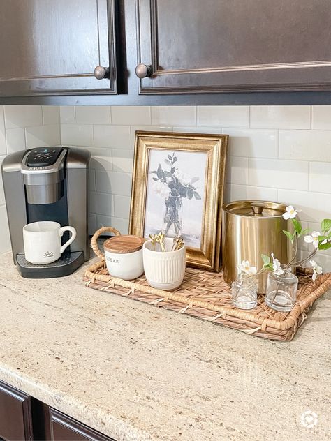 This coffee station is organized on a tray with a canister to hold k cups, a small canister for sugar and a small planter with stirs. I used a frame from Studio Mcgee and Target to cover up the cord to the coffee maker. Kitchen Counter Coffee Station Ideas, Kitchen Decorative Tray, Coffee Area Decor, Coffee Station On Kitchen Counter, Small Counter Coffee Station, K Cup Coffee Station, Corner Countertop Coffee Bar Ideas, Small Coffee Bar In Kitchen, Studio Mcgee Coffee Bar