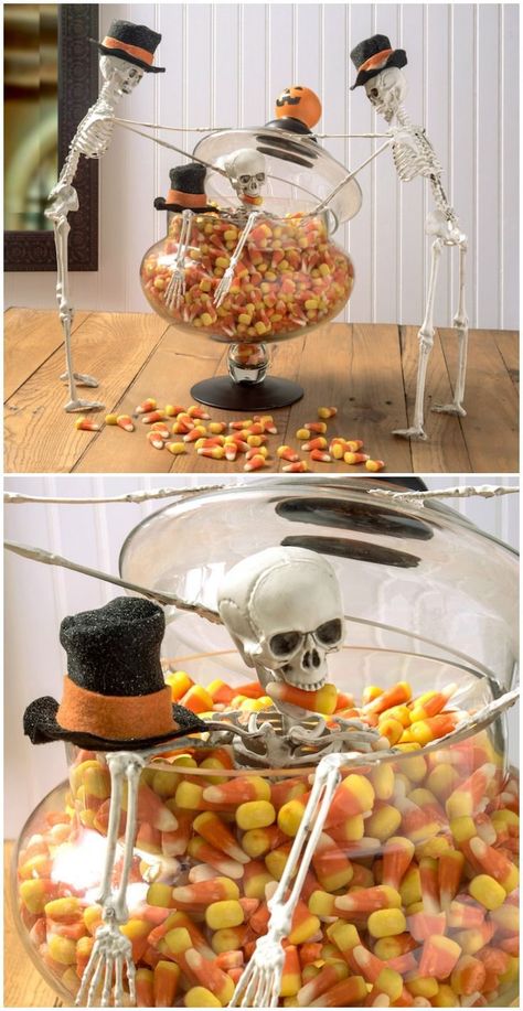 This DIY Halloween decor is hilarious! It's so easy to put together this skeleton in candy corn display; great for a party centerpiece. Click here to learn how to make. Halloween Candy Centerpiece Ideas, Candy Corn Display, Halloween Decorations Centerpieces, Skeleton Candy Display, Candy Corn Centerpiece Ideas, Skeleton Food Display, Halloween Food Display, Diy Halloween Centerpieces, Halloween Candy Display