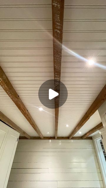 Alex & Wendy Santantonio on Instagram: "This #beadboard ceiling is one of the projects we’re most satisfied with. 
•
When working on our laundry room we set out to keep as much ceiling height as possible, cover the insulation, keep the joists visible, and add a little interest to the basement. The result, our recessed beadboard ceiling 😍🤌🤌🤌
•
The process was a relatively simple but very tedious one. Furring strips to support the beadboard, then measure, cut, fit, trim, fit, nail, repeat. Some people suggested using the beadboard plywood to reduce the need for individual pieces, but that would have been 10x harder. The joists are old, slightly twisted, and not straight, so the cuts to get a good and tight fit would have been very difficult. Also, if we ever have an issue behind the ceil B Board Ceiling, Bulk Head Ceiling Ideas, Porch Ceiling Ideas Cheap, Floor To Ceiling Beadboard, White Plank Ceiling, Stained Beadboard Ceiling, Ceiling Trim Ideas, Beadboard Porch Ceiling, Stained Beadboard