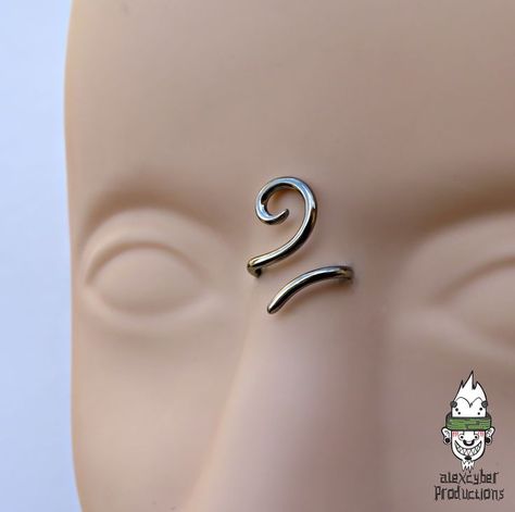 Handmade titanium third eye bridge 14 avalible on my Etsy shop, more sizes Next days #thirdeyebridgepiercing #thirdeyepiercing #thirdeye #thirdeyebridge #bridgepiercing #piercingentrecejo #etsystore #etsypiercing #titaniopiercing #titaniumpiercing #titaniumjewelry #cute #cutepiercing #piercedgirl #piercedgirlsofinstagram #ethnicjewellery #cutepiercing #spiral #espiral #alexcyberproductions Swirl Bridge Piercing, Spiral Bridge Piercing, Third Eye Piercing, Piercing Inspiration, Bridge Piercing, Spiral Jewelry, Henna Tattoo Hand, Tattoo Hand, Facial Piercings