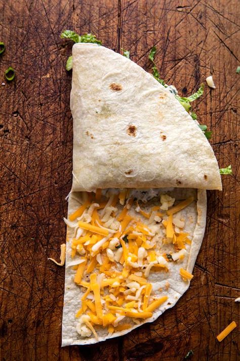 Folded Crispy Buffalo Chicken Wraps. - Half Baked Harvest Folded Burrito Sandwich, Folded Quesadilla Recipes, Chicken Nugget Wrap Recipe, Buffalo Chicken Burritos, Folded Quesadilla, Tortilla Hacks, Tortilla Hack, Keto Wraps, Burrito Wrap