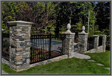 Aluminium Fence with stone columns by Artistic Outdoors Brick Wall Patio Ideas, Fence With Stone Columns, Wrought Iron Pool Fence, Fence Around Pool, Aluminum Pool Fence, Aluminium Fence, Brick Columns, Porch Plants, Driveway Entrance