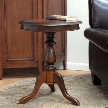 This accent table is ideal for a home that loves classic furniture in elegant wood finishes. The lathe-turned pedestal base and vintage rubbed finish are sure to add a touch of old world sophistication to your living room or bedroom. Wooden Accent Table, Pedestal End Table, Pedestal Side Table, Round Accent Table, Wood Pedestal, Wood Finishes, Laurel Foundry Modern Farmhouse, Classic Furniture, Wooden Tables