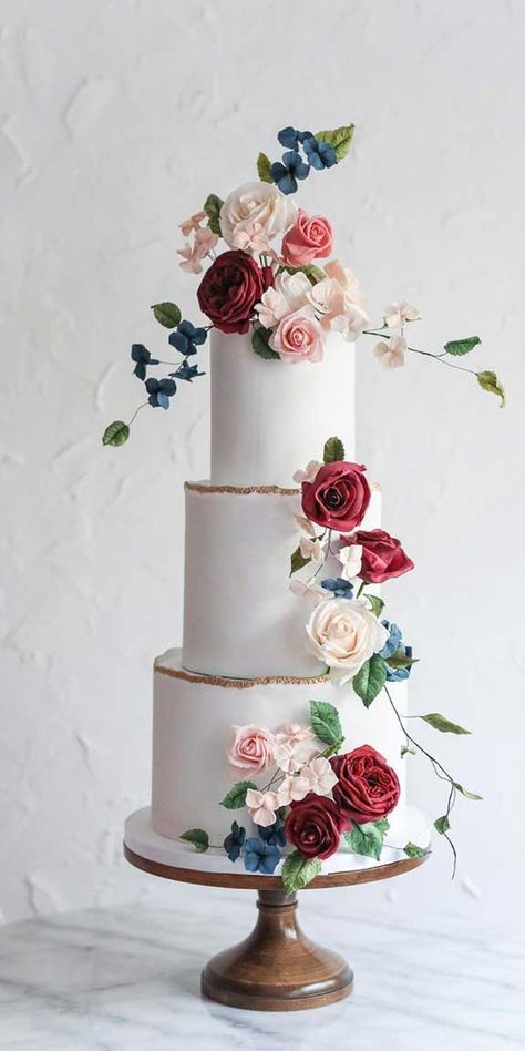 Just like bridal dresses, wedding cakes can also be trendy or obsolete. A traditional wedding cake is usually a white vanilla cake in towering... Cake With Red Flowers, Modern Red Wedding, Navy Blue Cake, Red Wedding Cake, Wedding Cake Pink, Bling Wedding Cakes, Textured Wedding Cakes, Bolo Vintage, Wedding Cake Vanilla