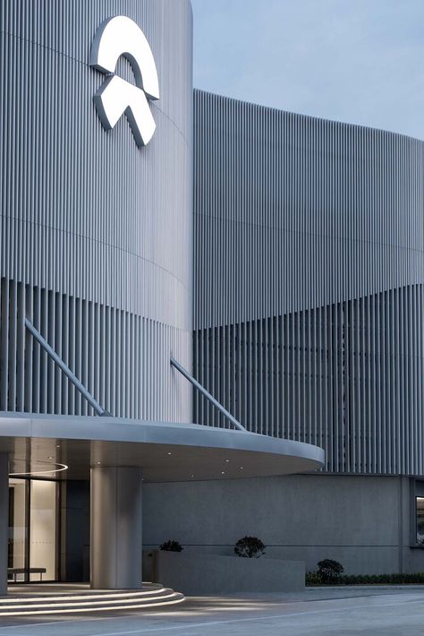 Gallery of NIO Delivery Center / Kokaistudios - 3 Facade Cladding, Hotel Logo, Environmental Graphic Design, Architecture Images, Garage Cafe, Entrance Sign, Environmental Design, Hotel Design, Office Interior Design