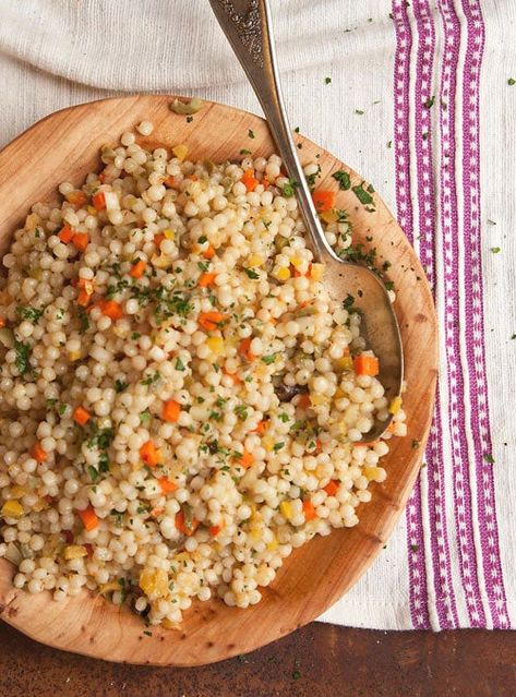 The flavors of a richly spiced Moroccan tagine come together in this couscous salad, savory and bright with olive, lemon,... Moroccan Couscous Salad, Summer Pasta Dishes, Summer Pasta Recipes, Couscous Salad Recipes, Cous Cous, Couscous Salad, Moroccan Food, Wooden Bowl, Middle Eastern Recipes