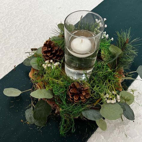 Eucalyptus, pine and moss, with baby's breath and pine cone accents Wood And Moss Centerpieces, Pine Table Decor, Moss Wedding Centerpiece, Evergreen Centerpiece, Mountain Theme Wedding, Woodland Forest Wedding, Eucalyptus And Pine, Kim Wedding, Yule Tide