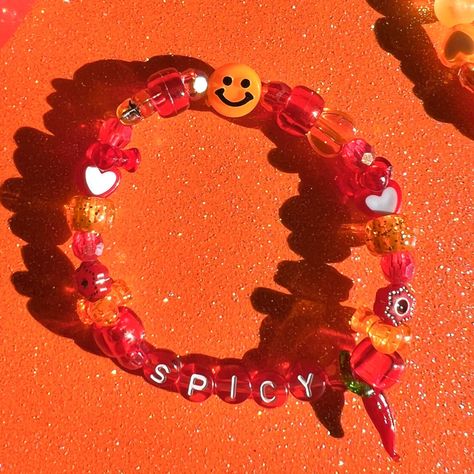 spicy bracelet 🌶️🥵❤️ details ❥ approximately 6.5 inches & super stretchy 🐛 ❥ can be adjusted to your sizing :) 🌈 ❥ want this same design but want it to say something else? i can do that 🍄 Festival Candy Bracelets, Plur Bracelets Kandi, Punk Kandi, Rave Kandi Bracelets Ideas, Kandi Phrases, Kandi Words Ideas, Ideas For Bracelets, Bead Bracelets Ideas, Emo Kandi