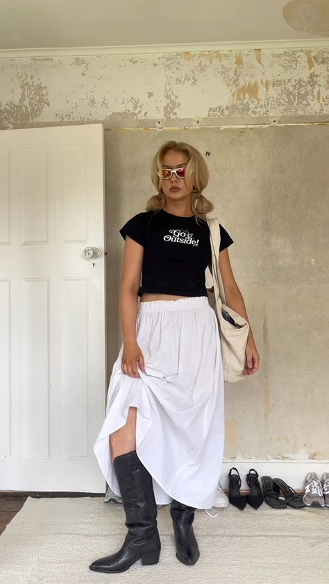 Ig: amyfuchsia cowboy boots | vintage tee | maxi skirt | baby tee | y2k sunglasses | wraparound sunglasses Baby Tee Maxi Skirt, White Skirt Cowboy Boots Outfit, Cowboy Boots Maxi Skirt, Fall Maxi Skirt Outfits With Boots, Maxi Skirt Cowboy Boots Outfit, Lower East Side Outfit, Maxi Skirt And Cowboy Boots, Baby Tee And Skirt, Maxi Skirt With Cowboy Boots