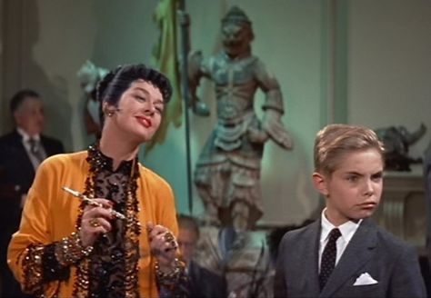 Rosalind Russell and Jan Handzlik as Auntie Mame and her little love, Patrick. Gangster Letters, Orry Kelly, Auntie Mame, Phoenix Fire, Rosalind Russell, Requiem For A Dream, Favorite Christmas Songs, Movie Fashion, Family Movies