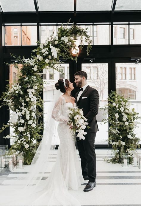 Greenery, Candles, Black and White, Winter, Romatic, Arch, Asymmetrical Photo // @stintography Venue // @shinolahotel Floral // @parsonageevents Winter Wedding Arch, White Wedding Arch, Candles Black, White Winter Wedding, Winter Candle, Black And White Wedding, Black White Wedding, Floral Arch, Art Deco Wedding