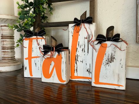 "This 4-piece fall block letter set is a great accent to your Fall and Thanksgiving decor! Great for a mantle or any tabletop. This item is hand painted and is finished with a ribbon top and natural wood stem. Fall Blocks Measurements:6\"longX3.5\"wide/4\"longX3.5\"wide/7\"longX3.5\"wide/5\"longX3.5\"wide" Easy Fall Wood Crafts, Fall Wooden Crafts, Fall Diy Decorations, Mantle Fall Decor, Fall And Christmas Decor, Woodshop Projects, October Decor, Woodworking Decor, 2x4 Crafts