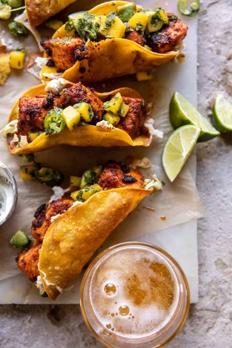 Crispy BBQ Salmon Tacos with Avocado Mango Salsa and Jalapeño Cream | halfbakedharvest.com Half Baked Harvest Fish Tacos, Slow Cooker Recipes Fish, Salmon Tacos With Mango Salsa, Salmon Taco Recipes, Mexican Bbq, Bbq Tacos, Tacos With Avocado, Bbq Salmon, Taco Salad Recipe