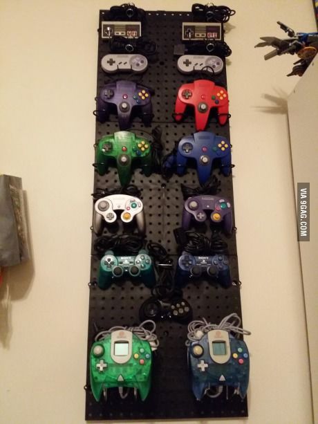 Finally setup up my wall of controllers - metal pegboard tiles to create hanging wall for gaming controllers Nerd Bedroom, Video Game Organization, Controller Storage, Video Game Storage, Diy Video Game, Nerd Room, Video Game Controllers, Retro Games Room, Create Room