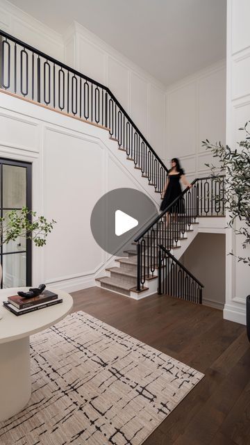 LUX decor on Instagram: "The stairwell at our Glenmore Project is another moment—a perfect blend of impact and elegance that so many of you have asked about. The metal detailing on the spindles adds a touch of modern sophistication while keeping the design timeless. It’s a space that feels grand yet understated, with every detail thought through for a busy, high-traffic home. The runner we chose is both stylish and practical, standing up beautifully to the hustle and bustle of a big family while still maintaining that luxurious feel underfoot. It’s another example of how functionality and beauty can coexist, and why this stairwell continues to be a fan-favourite. 

Design by LUX decor
Architecture by Rhona Goldenberg" Dual Staircase Entryway, Dual Staircase, Stairs Railing Design, Transitional Staircase, Foyer Stairs, Metal Spindles, Lux Decor, Metal Handrails, 2 Story Foyer