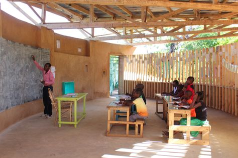 The Scarcity and Creativity Studio and Students > Eco Moyo Education Centre | HIC Outdoor Teaching Space, Fabric Ceiling, Roof Trusses, Vernacular Architecture, Curved Walls, Roofing Sheets, Tropical Climate, Education Center, Metal Roof