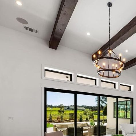 Blue Mountain Communities on Instagram: "Our “Great Rooms” live up to their name. They include 12ft ceilings, optional 10x10 beams & walls of glass to bring the outdoors in. Transom windows over the glass stacking or sliding doors provides more natural sun light and height. Pairing these selections with plank vinyl or hardwood flooring from our amazing design studio will make this room your inviting gathering space. 

#northerncaliforniahomes #norcalhomes #sacramentorealestate #realestateagentsacramento #bluemountaincommunities #bethelisland #norcalrealestate #californiarealestate #californiarealtor  #californiahomes #sacramentohomes #eldoradohills #eldoradohillsrealestate #realestate #realtor #interiordesign #newhome #newconstruction #newhomes #northerncalifornia #homesforsale #sacramento 12ft Ceilings, California Real Estate, Transom Windows, Sun Light, Gathering Space, Hardwood Flooring, California Homes, Blue Mountain, Small Living