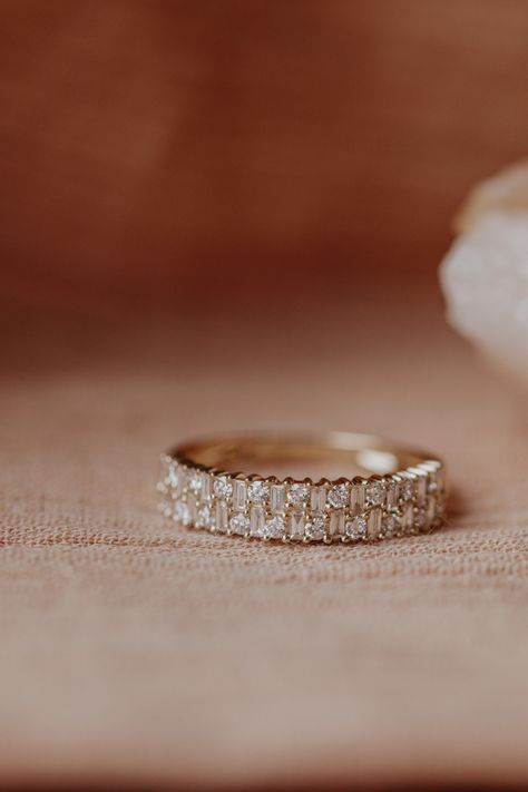 14k gold band with two rows of .53 cts of baguette and round diamonds, set in prongs in an alternating pattern. Available in rose, yellow, or white gold. Gold Baguette Ring, Baguette Diamond Ring, Ring Baguette, Stacked Wedding Bands, Baguette Diamond Rings, Baguette Ring, Round Diamond Ring, Dream Engagement Rings, To Infinity And Beyond