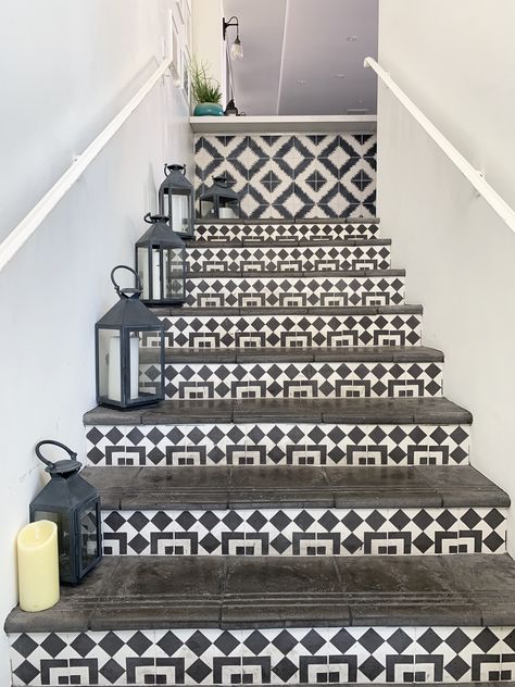 Black and white Moroccan tiles used as stair risers and black treads with lanterns make for a fun modern boho vibe. #stairs #blackandwhite #boho #moroccan #tiledstairs #tile #staircase Tile Staircase, Stair Tiles, Stairs Tiles Design, White Moroccan Tile, Greece Homes, Tiled Staircase, Front Door Steps, Tile Steps, Black Stairs