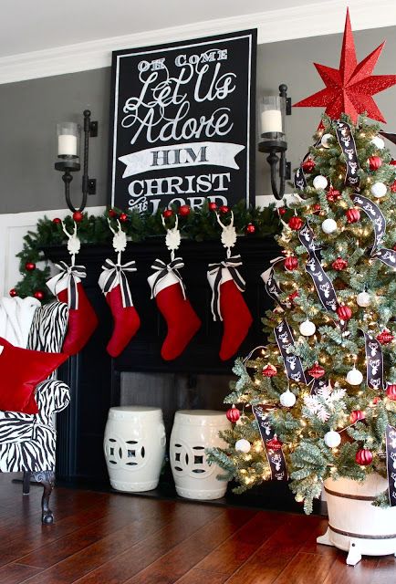 White Stocking Holders and White Garden Stools Help To Keep the Black Fireplace From Looking Too D ark. - 2015 Holiday House Tour Ideas Decoracion Navidad, Diy Christmas Fireplace, Red Christmas Decor, The Mantle, Christmas Mantle Decor, Christmas Fireplace Decor, Christmas Mantel Decorations, Black Christmas Trees, Christmas Mantle