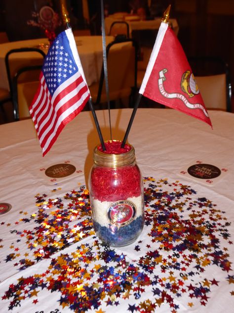 Mason jars (plain, no wording on them) Colored rice (food coloring and vinegar) Pioneer Marine Corps Metal Medallion (Amazon) Gold ribbon (place inside of the top) 4X6 American Flag & Marine Corps flag with black pole and metallic gold top Marine Corps Desserts, Marine Corps Birthday Party, Marine Decorations Party, Marine Centerpieces, Marine Corps Themed Party, Marine Corps Ball Centerpieces, Us Navy Centerpiece Ideas, Marine Party Decorations, Marine Retirement Party Ideas