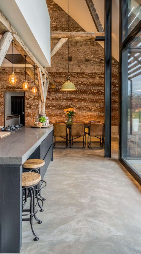 Old farmhouse converted into a warm industrial farmhouse with view of an old brick wall, and original wooden beams. Warm Industrial, Industri Modern, Old Brick Wall, Interior Design Per La Casa, Industrial Living, 카페 인테리어 디자인, Decor Shabby Chic, Industrial Interiors, Exposed Brick Walls