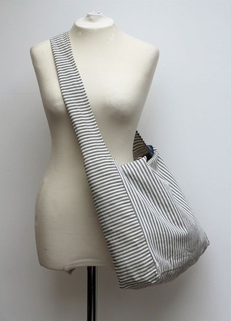 A really lovely, large bag made in French cotton ticking. It can be comfortably worn across the body for every day use. We have also made it with handles for the times when you want to hold it like a tote. Very handy indeed. Each bag has it's own unique lining! Fully lined in cotton shirt fabrics, with two internal pockets. The shirts used to line our bags are from quality shirt makers of Jermyn Street, London. Our fabrics are of the highest quality, making it a very strong, versatile bag for an