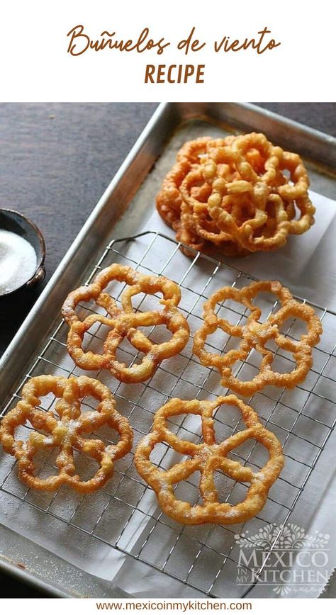 How to make Buñuelos de viento │“Buñuelos de Viento” and “Buñuelos de Molde” literally translate to “Wind Fritters” and Mold-Shaped Fritters”, respectively. These are made using iron molds, as opposed to the more traditional Mexican buñuelos that are made by rolling out the dough and forming circles (like a flour tortilla) which are then fried and dusted with sugar. #mexicanrecipes #homecook #foodrecipes #easyrecipes #buñuelos Mexican Fritters, How To Make Buñuelos, Bunuelos Recipe, Holiday Party Desserts, Authentic Mexican Recipes, Mexican Foods, Fritter Recipes, Mexican Dessert, Easy Mexican