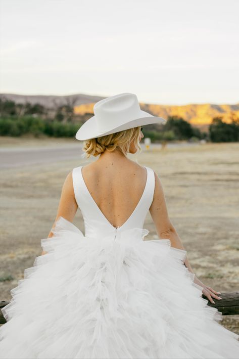 City Boot cowboy boots ross wedding dress rita vinieris Authentic fun candid wedding photography Artistic wedding photography Western bridal designs with ruffles fashion photography bridal portraits bridal western aesthetic editorial bridal portraits bride photos wedding dress dream wedding nature editorial bride engaged stetson cowboy hat wedding black and white photographer photo by @Kristakphotos Bride With Cowboy Hat, Bridal Cowboy Hat, Western Wedding Aesthetic, Cowboy Hat Wedding, Photoshoot Western, Nature Editorial, Aesthetic Editorial, Aesthetic Bride, Editorial Bride