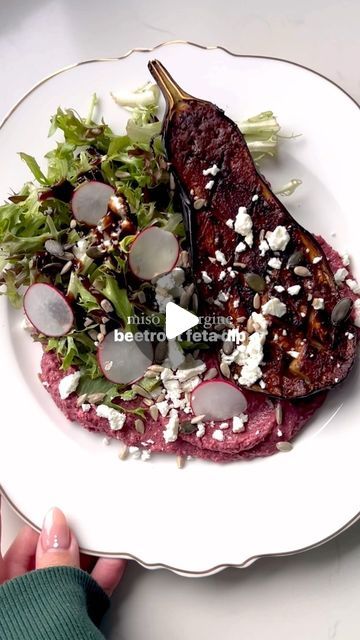 Elizabeth (Lilly) Assender on Instagram: "Super healthy miso aubergine, beetroot feta dip 🍆

Easy mid week dinner ideas, that taste great and are good for you….👇🏻

Ingredients 
1 aubergine 
1 tsp miso paste, sesame seed oil + light soy
3 cooked beetroot 
100g feta 
Handful pine nuts 
Juice 1/2 lemon 
1 tbsp olive oil
Salt 
1 tbsp balsamic vinegar 
Mixed leaves 
Optional garnish - balsamic glaze, radishes, feta, pumpkin seeds 

Method
1. Have the aubergine and score both ways, rub with a little olive oil and airfry at 200c for 15 mins. 
2. Blend together beetroot, feta, lemon juice, pine nuts, olive oil and salt. Add a little balsamic vinegar. 
3. Mix together miso paste, sesame seed oil + soy. Spread over the cooked aubergine, cook for a further 5 mins in the air fryer. 
4. Spread the b Week Dinner Ideas, Miso Glazed Aubergine, Japanese Miso Eggplant Recipe, Eggplant Halloumi, Cooked Beetroot, Miso Aubergine, Miso Eggplant Japanese, Smitten Kitchen Eggplant, Sesame Seed Oil