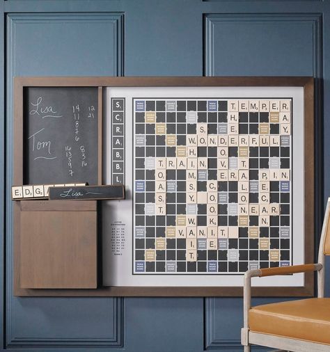 Perfect for casual, ongoing games, this oversized version of Scrabble hangs on the wall of your home or office and features custom graphics inspired by the original 1949 edition. Crafted with a solid wood frame and trim, this set includes 100 oversized magnetic tiles, four tile racks with chalkboard backs, chalk, eraser and solid wood storage box. Outdoor Foosball Table, Wall Scrabble, Game Table And Chairs, Scrabble Board, Wall Game, Scrabble Wall, Campus Design, Shuffleboard Table, Letter Tiles