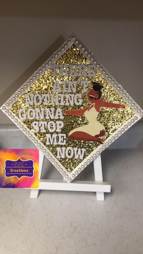 Box Braids Graduation Cap, Tiana Cap Decoration, Graduation Cap Designs Nicki Minaj, Badazzel Grad Cap, Proud Family Graduation Cap, Cap N Gown Decorations, Grad Cap With Crown, Princess And The Frog Cap Decoration, Princess Tiana Grad Cap