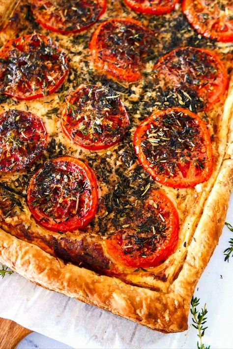 Baked tomato tart resting on a wooden cutting board. Tomato Tarte, Shrimp Pasta Dishes, Tomato Tart Recipe, Garlic Butter Pasta, Impressive Appetizers, Puff Pastry Crust, Butter Pasta, Tomato Tart, Baked Cod