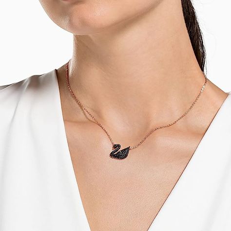 Elegant and beautiful: Swarovski Iconic Swan Pendant, featuring a timeless Swan motif with gorgeous sparkling black crystal stones, showcases our classic legendary Swan with a modern twist Stunning and distinctive: Radiant black Pointiage crystals combined with Swarovski´s signature Swan and an adjustable length rose-gold tone plated chain help you stand out from the crowd Swan Jewelry, Swan Pendant, Swan Design, Swan Necklace, Swarovski Swan, Minimal Necklace, Swarovski Necklace, Wear Necklaces, Swarovski Jewelry